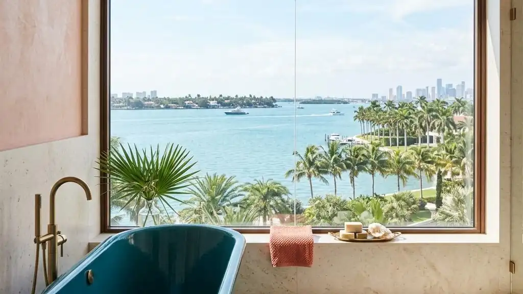 Bathroom window looking out over Biscayne Bay and palm trees